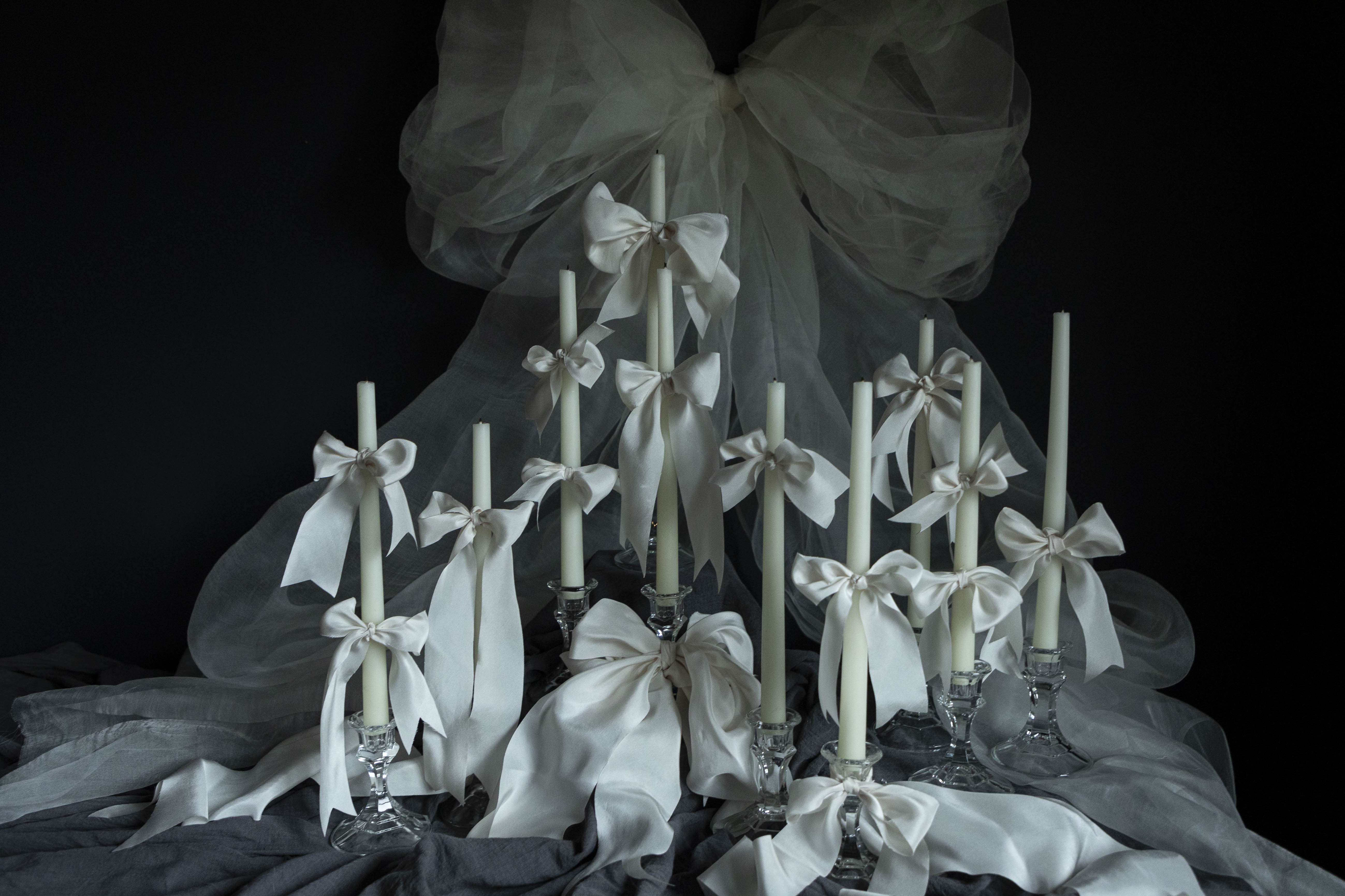 The Art of Ribbon Bows on Candles for Special Events