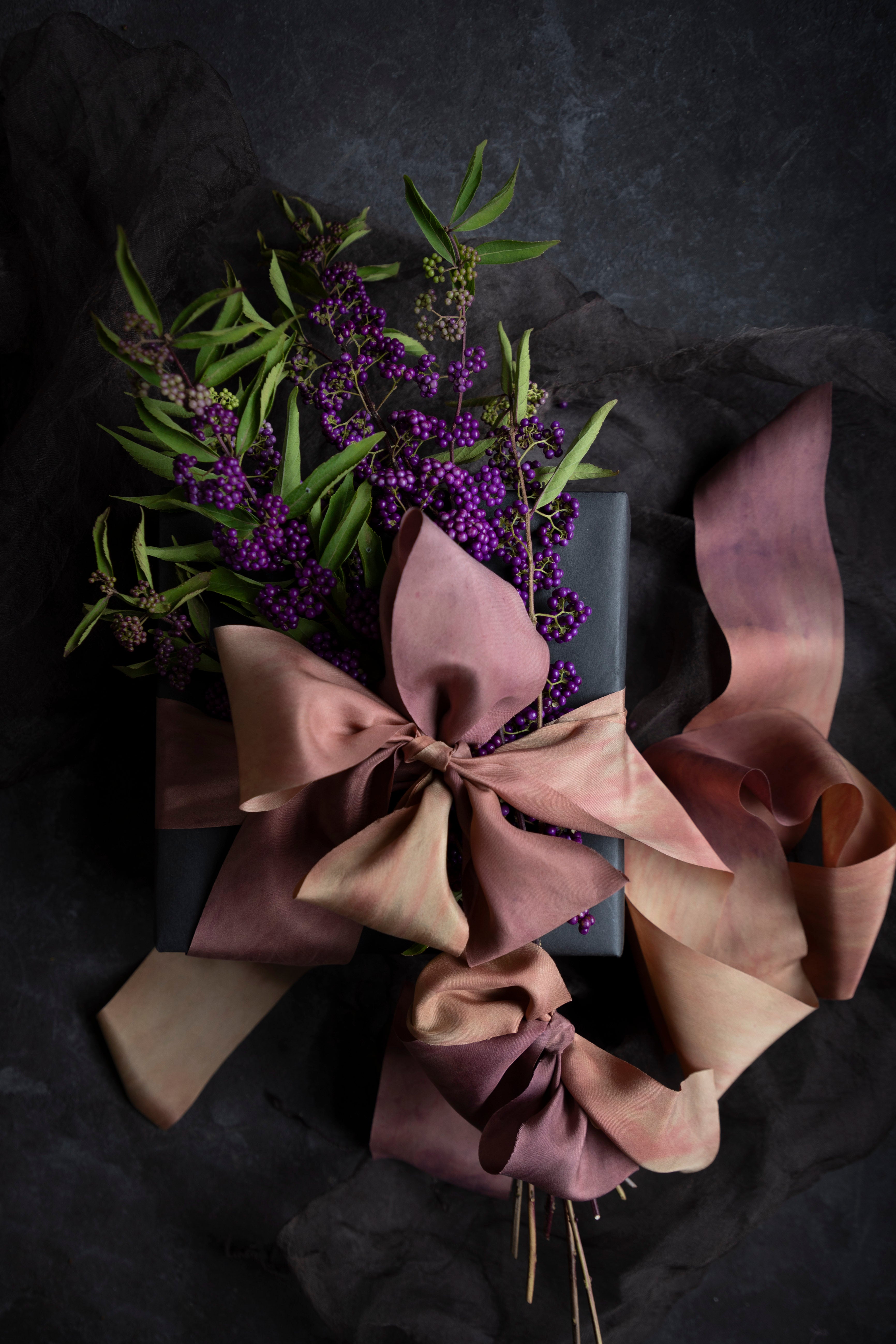 gift wrapping inspiration with black wrapping paper and custom dyed silk ribbon by silk and willow