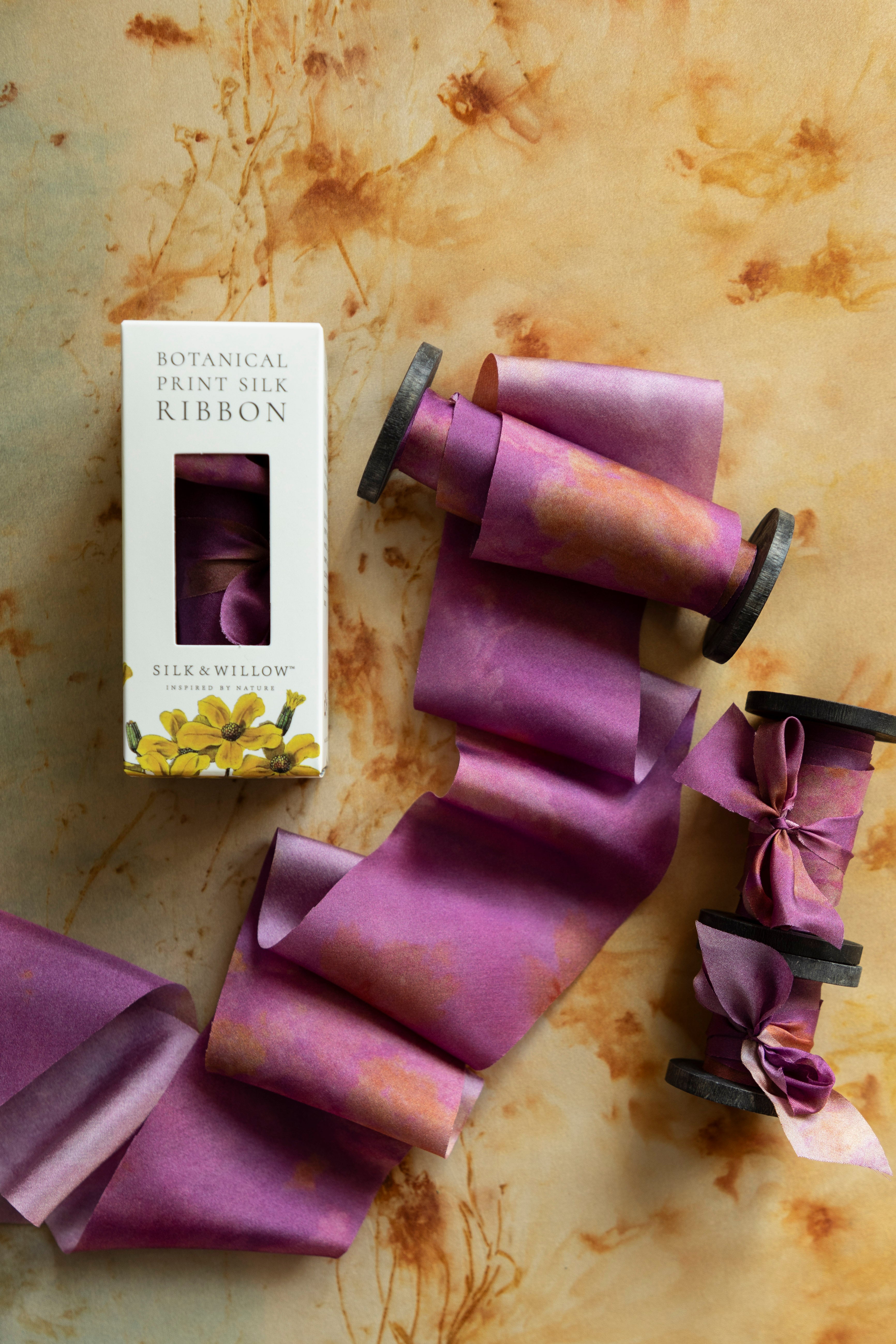 Eco-friendly silk ribbons with nature-inspired patterns, perfect for unique gift wrapping and tying market bouquets, crafted from sustainable materials