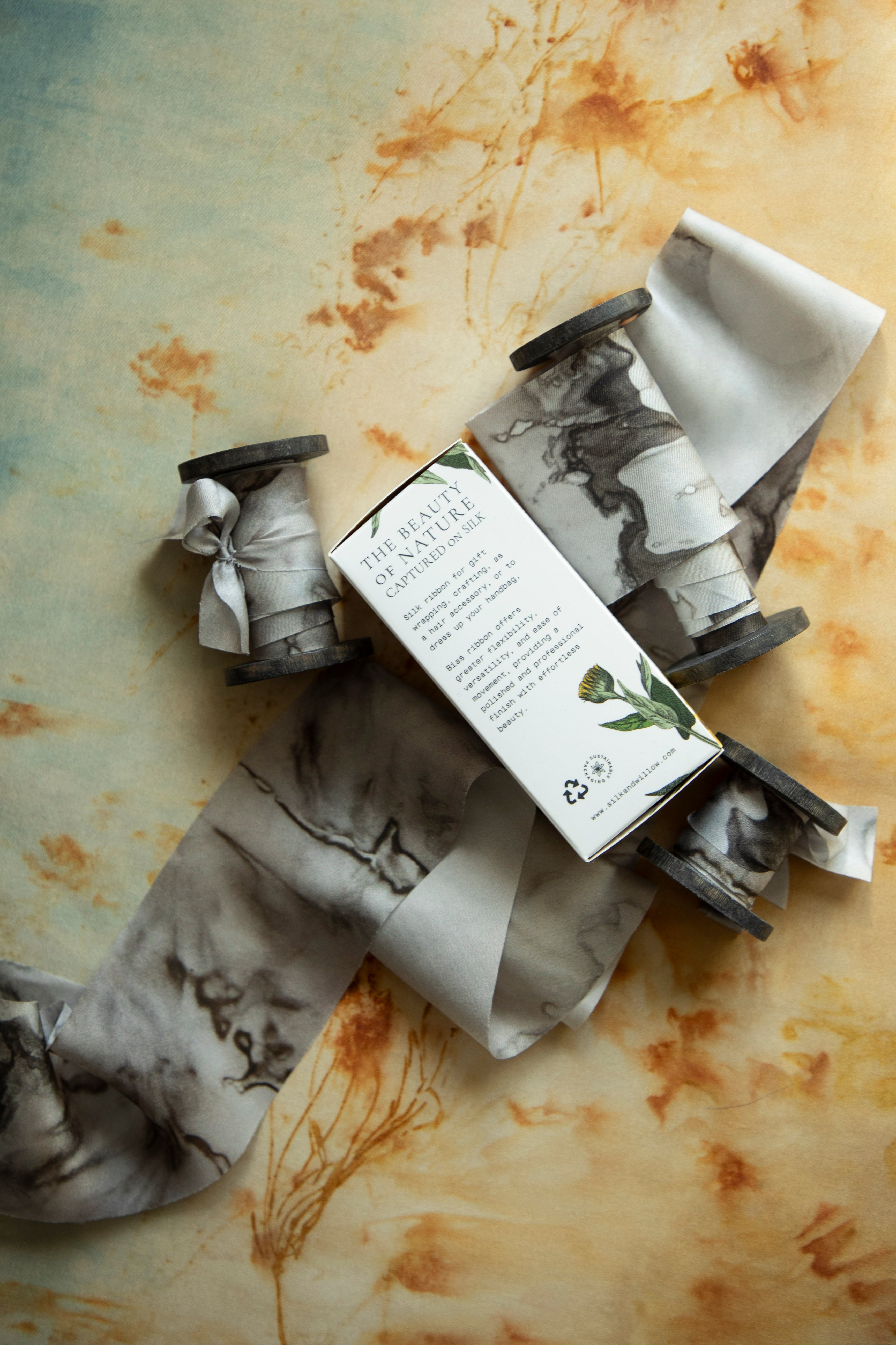 Eco-friendly silk ribbons with nature-inspired patterns, perfect for unique gift wrapping and tying market bouquets, crafted from sustainable materials