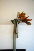 mantel decor with magnolia leaves and emerald green silk ribbon. the best bridal bouquet silk ribbon