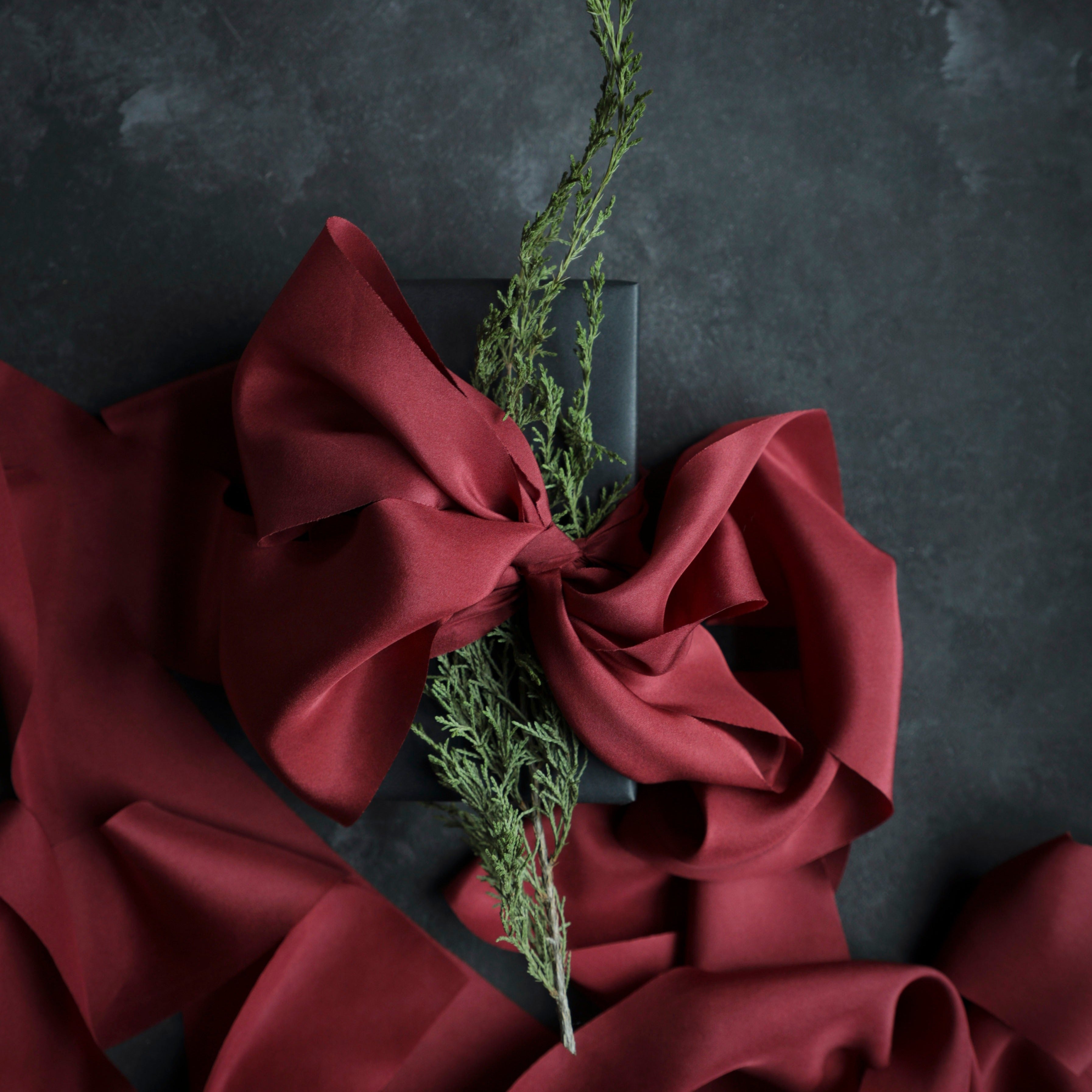 Red silk ribbon for wrapping gifts on white background. 24871843