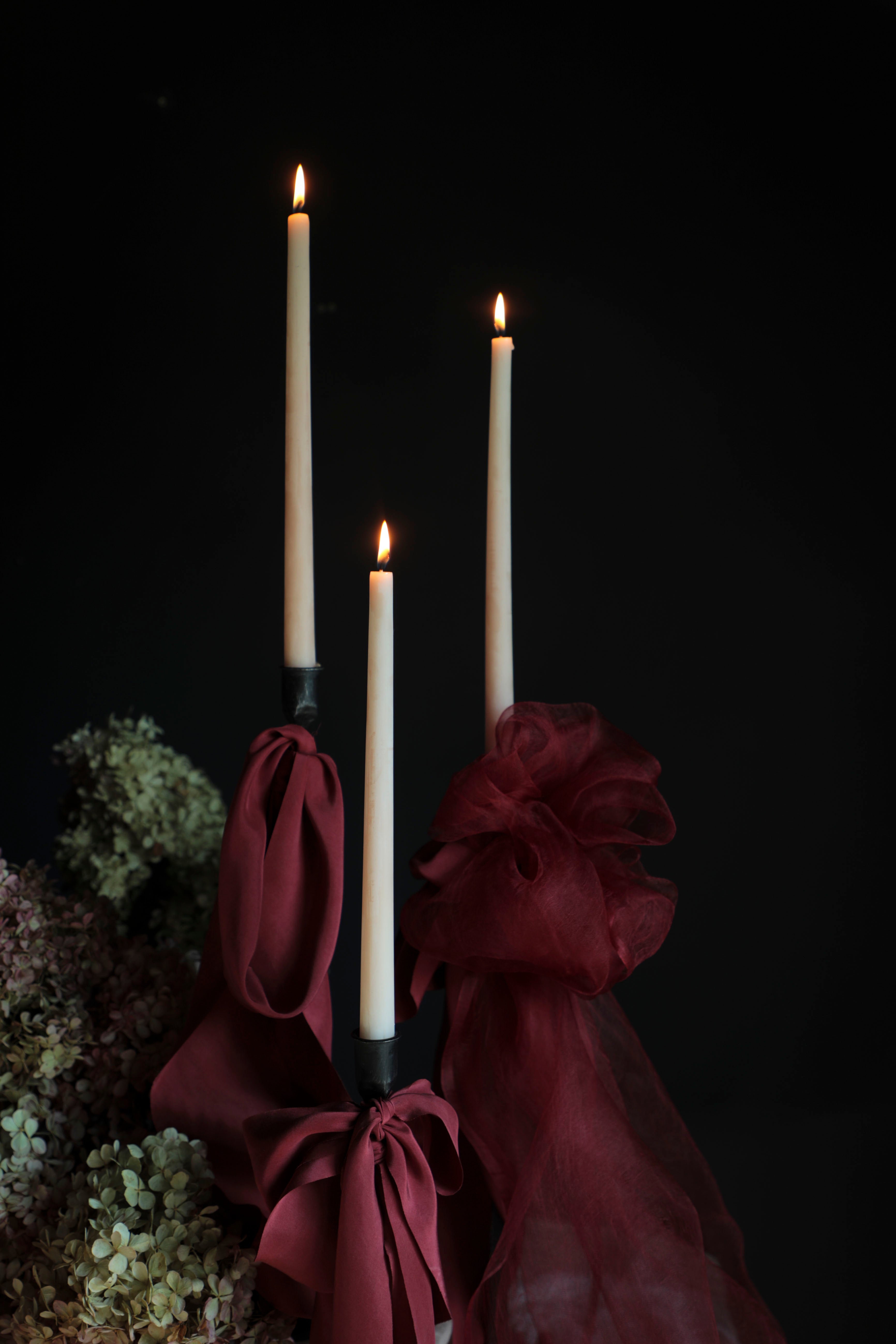 red wedding palette. red silk ribbon bows on candle display. wedding stylist silk and willow