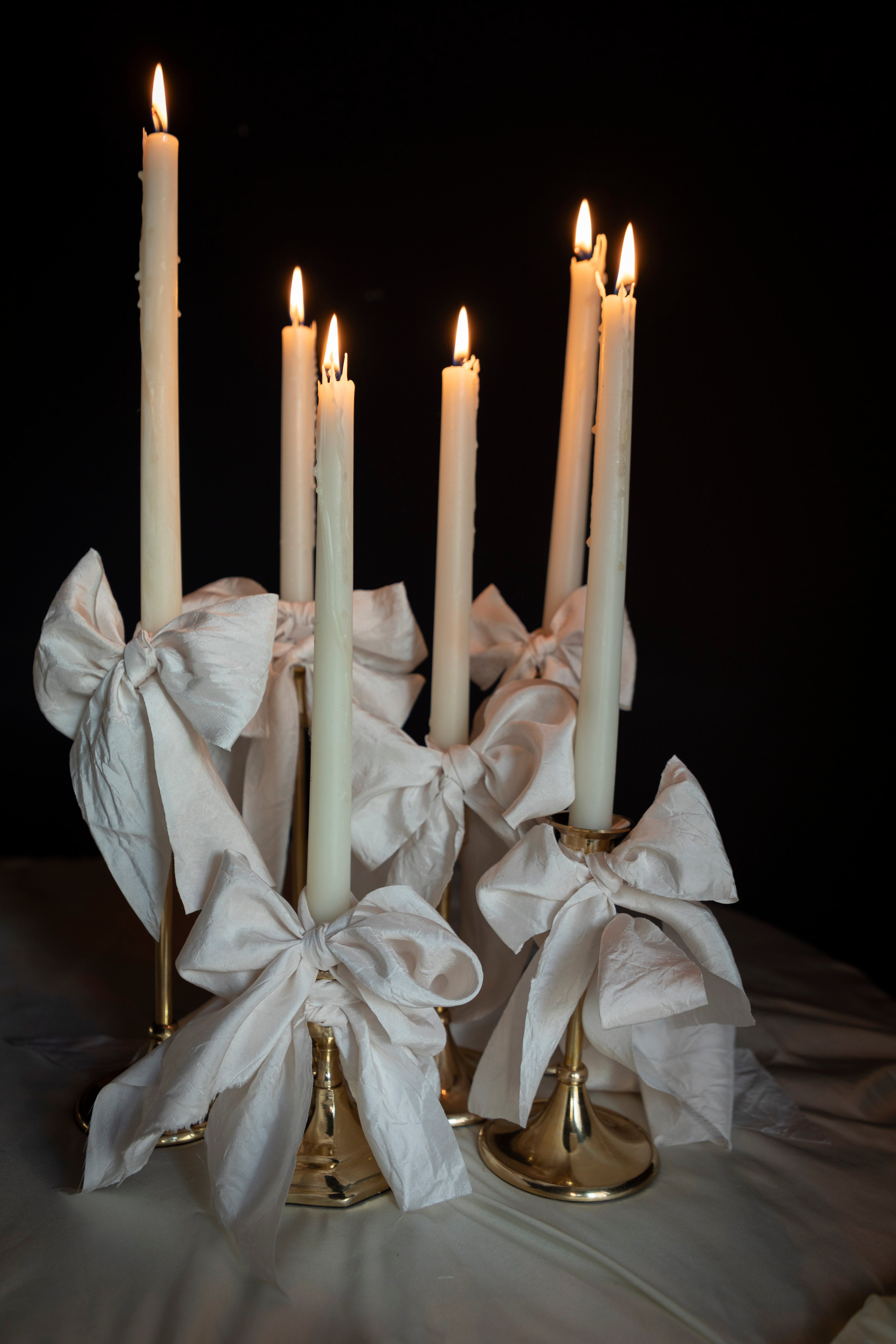 bridal white silk ribbon bows on candle display. event design by wedding stylist shellie pomeroy