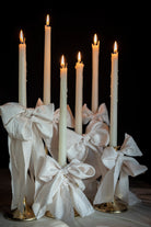 ribbon bows on candles. Weddding table designs by wedding stylist shellie pomeroy