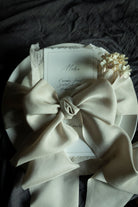 Ultra-luxe bridal bouquet silk ribbon showcasing its premium thickness and elegant drape. the highest quality silk ribbon on the market for creating bespoke wedding details. Silk ribbon featured in a tablescape design for wedding tables.